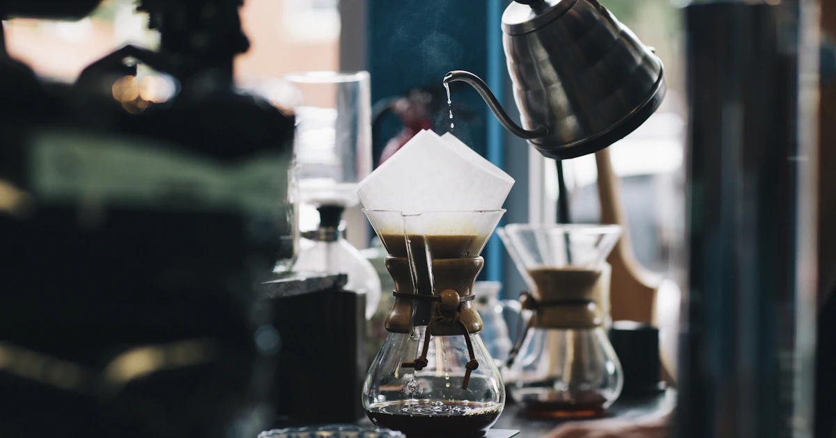 Pour-over coffee brewing at a café counter, an easy indoor date when it rains in Hawaiʻi